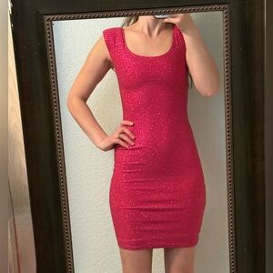 Beautiful pink bodycon mini dress with glitter detail,by Wendye Chaitín,Size XS.